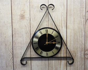 pequeño reloj de pared