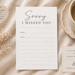 May include: A printable PDF card with the text "Sorry I Missed You" in elegant script. The card includes spaces for a name and date, and is 4 x 6 inches. A cup of coffee sits on a saucer in the background.