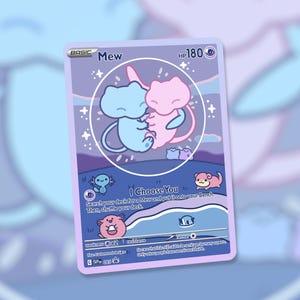 May include: A custom-designed Pokémon trading card featuring two Mew characters in blue and pink, encircled by a white outline. The card has a purple and blue background with the text "I Choose You".