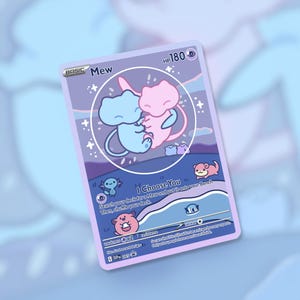 May include: A collectible card featuring two Mew characters embracing within a circle. The card has a purple background with the text "Mew" and "I Choose You". Other small cartoon characters are also visible.