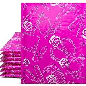 May include: Pink poly mailers with a white design of roses, perfume bottles, lipstick, and makeup brushes.