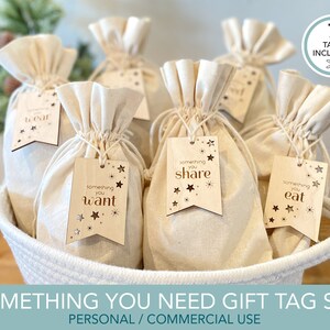 May include: A set of seven wooden gift tags with a star and snowflake design. The tags are labeled with the text "something you wear", "something you want", "something you share", "something you eat".