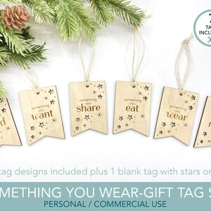 May include: Set of seven wooden gift tags with a star design and the text "something you need", "something you want", "something you share", "something you eat", "something you wear", "something you read", and a blank tag with stars only. The tags are attached to twine.