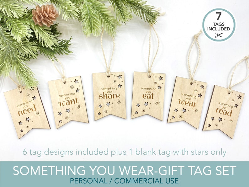 May include: Set of seven wooden gift tags with a star design and the text "something you need", "something you want", "something you share", "something you eat", "something you wear", "something you read", and a blank tag with stars only. The tags are attached to twine.