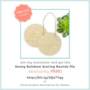 May include: Two wooden round signs with a rainbow, hearts, stars, and flowers design. The signs are hanging from a leather cord. The sign on the right is half painted wood and half engraved with the design. The text on the image reads "Free File Alert!" and "Join my newsletter and get this Sunny Rainbow Scoring Rounds file absolutely FREE! http://bit.ly/3Qa7Yqy or check product description for details."