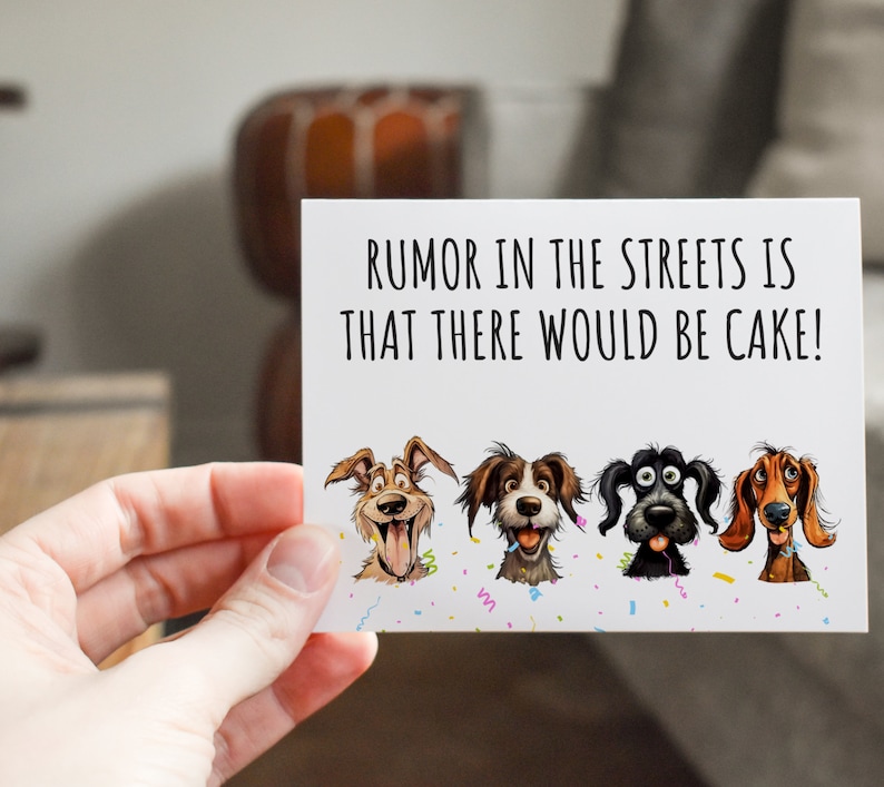 May include: A white card with the text "RUMOR IN THE STREETS IS THAT THERE WOULD BE CAKE!" and four cartoon dogs with different expressions. The dogs are surrounded by confetti.