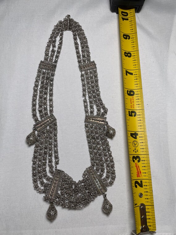 Silver metal necklace.