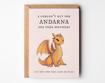 May include: A birthday card featuring an orange cartoon dragon on a pink background. The card has the text: "I couldn't get you Andarna for your birthday, so I got you this card instead." The card is inside a brown envelope.