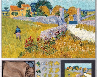 May include: A jigsaw puzzle depicting a painting by Vincent van Gogh. The puzzle shows a rural scene with a stone wall, a gate, and a figure walking in a field. The colors are bright and vibrant, with shades of yellow, blue, green, and brown.