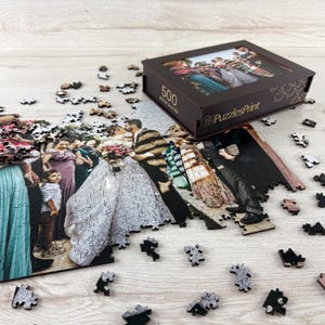 Personalized wooden photo puzzle with scattered pieces and custom puzzle box, wedding photo jigsaw puzzle gift.