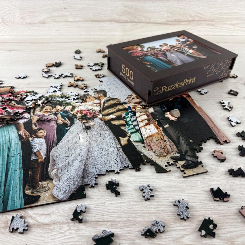 Personalized wooden photo puzzle with scattered pieces and custom puzzle box, wedding photo jigsaw puzzle gift.