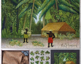 May include: A jigsaw puzzle depicting a painting by Henri Rousseau titled "The Hungry Lion." The puzzle shows a jungle scene with two figures carrying bunches of bananas, a small hut, and a lion in the background. The puzzle is in a wooden frame with a bag and loose puzzle pieces.