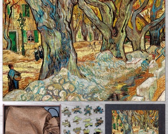 May include: A completed jigsaw puzzle depicting a street scene with large trees, in the style of Van Gogh. The puzzle is mostly assembled, with a few pieces remaining. A box, a bag, and a framed image of the puzzle are also present.