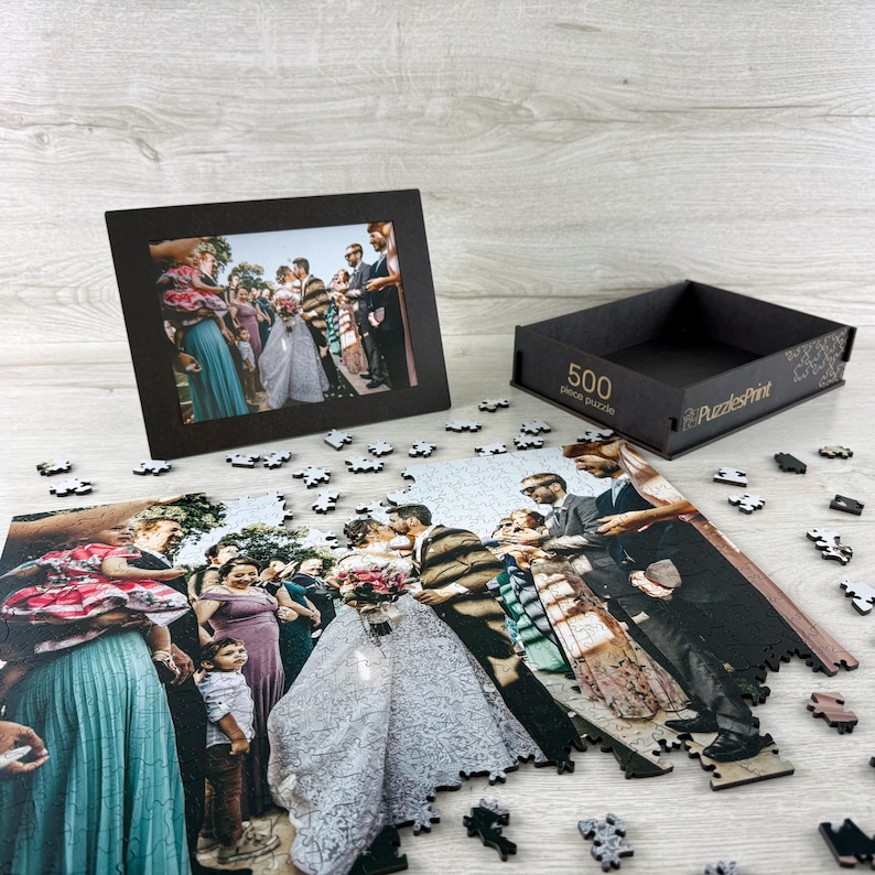Personalized wooden jigsaw puzzle made from a wedding photo, custom photo puzzle with scattered pieces and premium puzzle box gift.