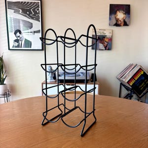 Minimalist Black Metal Wine Rack – 6-Bottle Countertop Storage, Modern Industrial Bar Décor (c. 1990s)