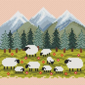 May include: Cross-stitch design featuring a pastoral scene with white sheep grazing in a green meadow dotted with red flowers. Behind the sheep are green pine trees and blue mountains, all set against a light pink background.