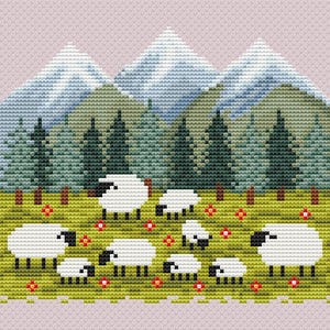 May include: A cross-stitch design featuring a pastoral scene with white sheep grazing in a green meadow dotted with red flowers. Behind the sheep are green trees and blue mountains, all set against a light pink background.