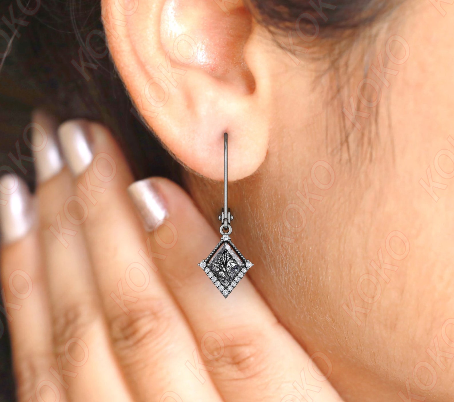 Gothic rutile quartz kite earring worn in ear, showcasing elegant drop and sparkle