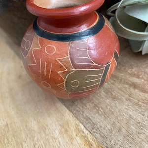 May include: A set of three ceramic mugs with a speckled, matte finish. The mugs are in shades of cream, light gray, and dark gray. Each mug has a simple, minimalist design, perfect for coffee or tea.