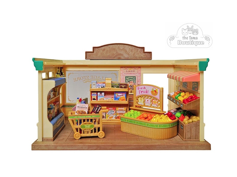 May include: A miniature toy grocery store with shelves stocked with food items, a shopping cart, and a display of fresh fruits. The store has a sign that says "Village Store" and "Fresh Fruit".
