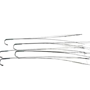 May include: Four silver-toned metal hangers with hooks. The hangers are arranged in a row, with the hooks facing the same direction.