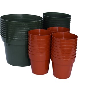 May include: A stack of dark green plastic plant pots and a stack of terracotta plant pots.