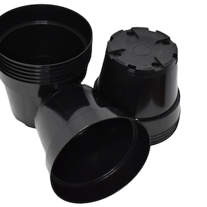 May include: Three black plastic plant pots of different sizes. The pots are stacked on top of each other.