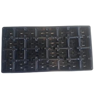 May include: Black plastic seed starting tray with 36 individual cells. Each cell has a small drainage hole in the bottom.
