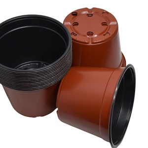 May include: A stack of brown plastic plant pots with black rims. The pots have drainage holes in the bottom.