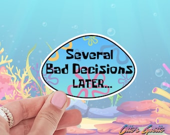 May include: A blue and yellow sticker with the text "Several Bad Decisions Later..." in black text. The sticker is shaped like a speech bubble and has a cartoonish design.