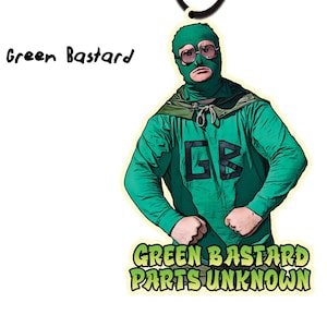 Puede incluir: Ambientador de coche Green Bastard Parts Unknown con un personaje de superhéroe verde con máscara y el texto "Green Bastard Parts Unknown". El aroma es "Greasy Lime Dropkick" y el ambientador está hecho por Trailer Park Boys.