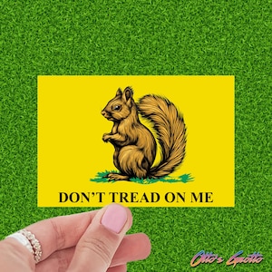 May include: A yellow sticker with a brown squirrel illustration and the text "DON'T TREAD ON ME".
