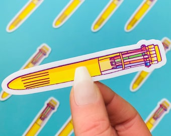 May include: A yellow pen with a white background and multiple colored ink cartridges. The pen is a sticker and is being held by a hand.