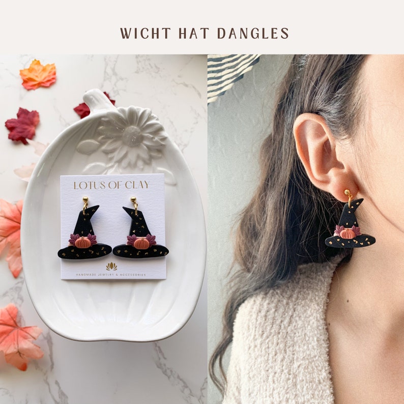 May include: A pair of black witch hat dangle earrings with a gold glitter finish and a small orange pumpkin accent. The earrings are displayed on a white plate with a card that reads "LOTUS OF CLAY HANDMADE JEWELRY & ACCESSORIES".