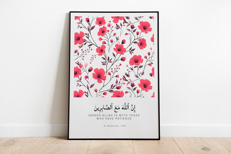 May include: A framed print with a white background and a floral pattern of pink flowers and dark gray stems. The print includes an Arabic quote and its English translation: "Indeed Allah is with those who have patience." The quote is attributed to Al-Baqarah 153.