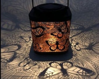 2 Solar Lanterns. Decorative Lantern, Butterfly or Dragonfly design. Delicate light illuminates the surrounding area. Outdoor Lantern, Solar