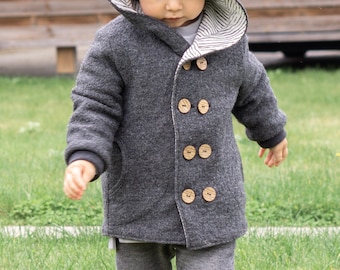 May include: A gray hooded jacket with a striped lining and wooden buttons. The jacket is made of a soft, fuzzy material.