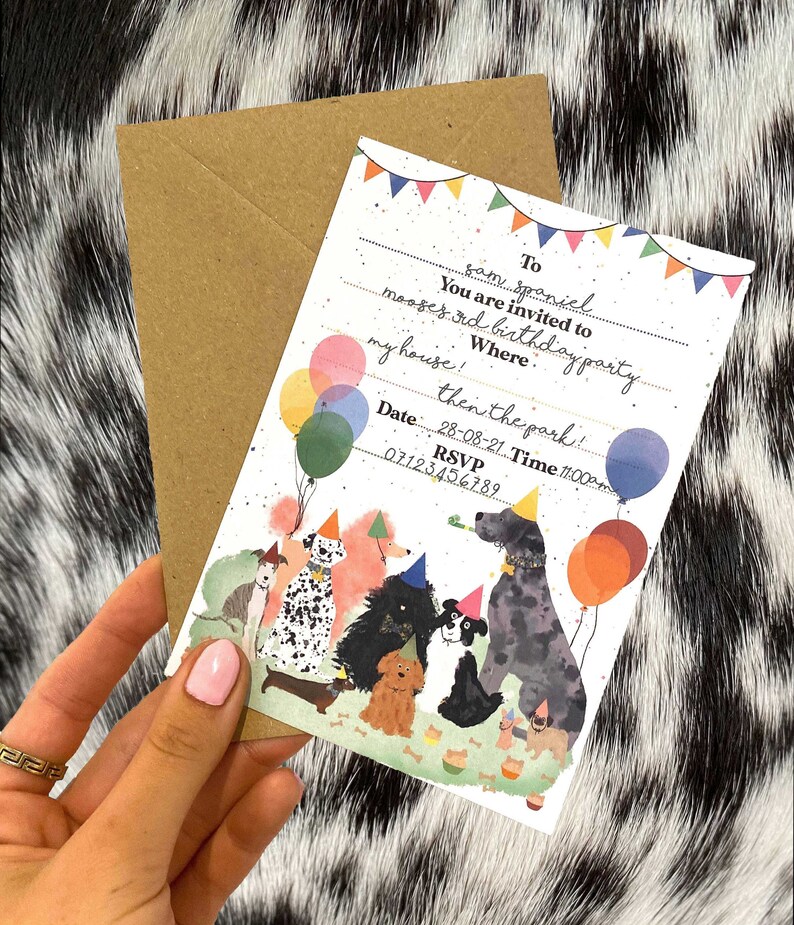 May include: A colorful birthday party invitation with a cartoon illustration of dogs wearing party hats and holding balloons. The text on the invitation reads "To Sam Spaniel You are invited to Moose's 3rd Birthday Party my house! then the park! Date 28-08-21 Time 11:00 RSVP 07123456789"