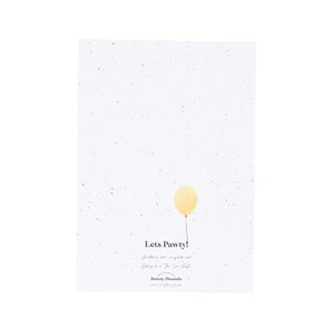 May include: A white card with a yellow balloon and confetti. The card says "Lets Pawty!" with a handwritten message below.