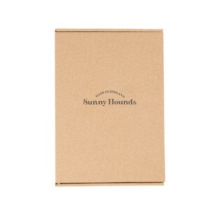 May include: A brown cardboard box with the text "MADE IN ENGLAND" and "Sunny Hounds" printed on it.