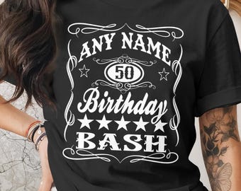 May include: Black t-shirt with a white graphic design. The design includes the words "ANY NAME" above the number "50" inside a circle, and the words "Birthday BASH" below, with stars and decorative flourishes.