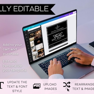 May include: A laptop computer screen displaying a mockup of a product label for "Vanilla Brownie Soy Blend" candle. The label is black with white text and a gold leaf design. The laptop is on a white surface with a smartphone next to it. The image shows a person's hands typing on the laptop keyboard. The text on the screen says "Fully Editable" and shows icons for updating text and font style, uploading images, and rearranging text and images.
