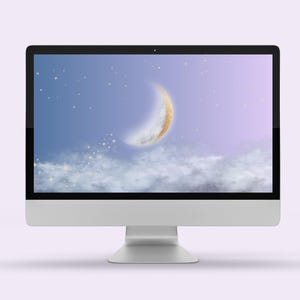 May include: A computer monitor displaying a digital illustration of a crescent moon with a gold glitter texture, set against a purple and blue gradient background with white clouds and sparkling stars.