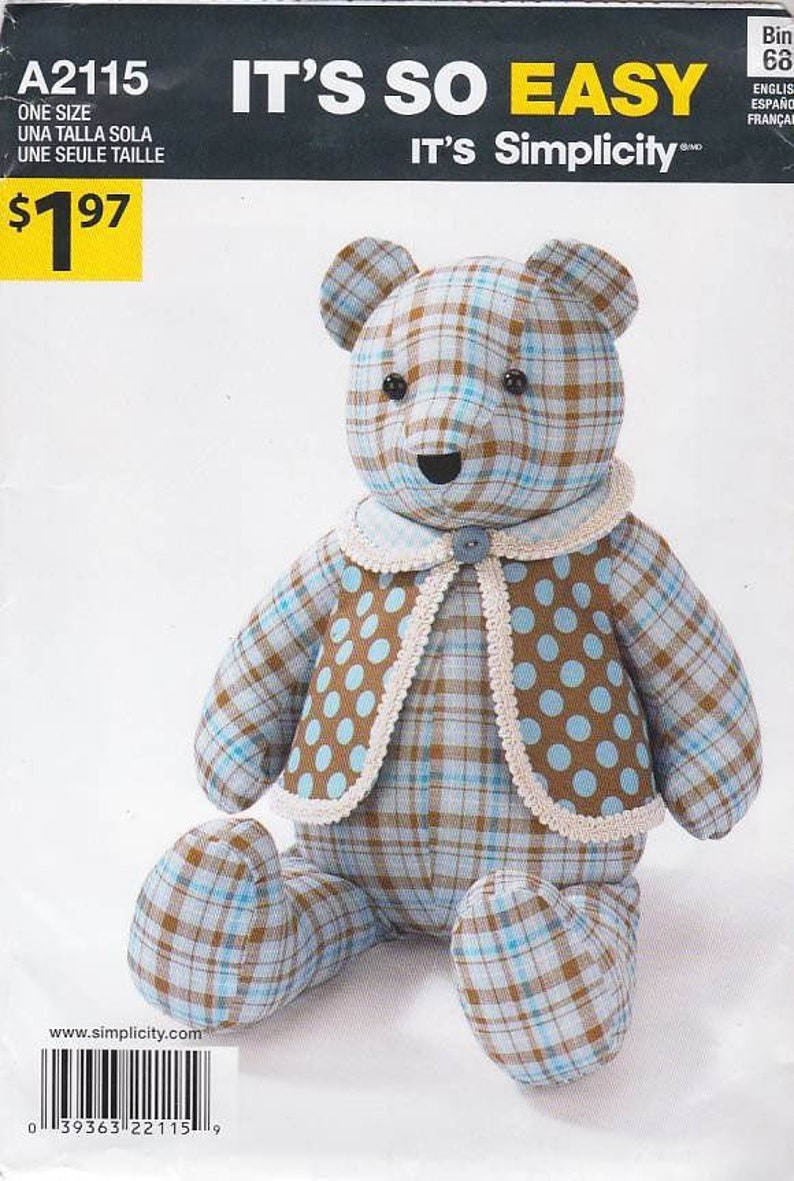 May include: A sewing pattern for a plaid teddy bear with a brown and blue polka dot waistcoat. The pattern is called "IT'S SO EASY" and is from Simplicity.