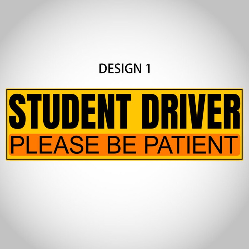May include: A rectangular yellow sign with black text that reads "STUDENT DRIVER PLEASE BE PATIENT." The text is centered and in a bold, sans-serif font. The words "PLEASE BE PATIENT" are in a smaller orange rectangle.