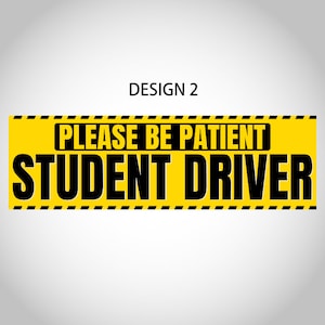 May include: A rectangular yellow sign with black text that reads "PLEASE BE PATIENT STUDENT DRIVER." The sign has a black and yellow striped border. The text "DESIGN 2" is above the sign.