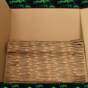 Kartonnen versnippering: opvulmateriaal, demping: gerecycled, geüpcycled, biologisch afbreekbaar: de ultieme milieuvriendelijke verpakkingsoptie
