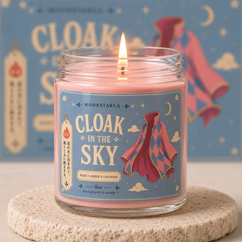 Moonstarca fantasy candle with floating cloak and dreamy sky design