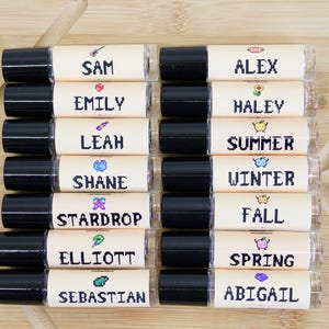 Pixel art Stardew Valley inspired perfume oil roll on featuring Elliott Shane Winter Summer Fall and Stardrop scents