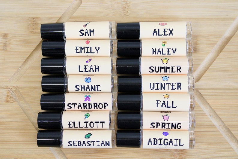 Pixel art Stardew Valley inspired perfume oil roll on featuring Elliott Shane Winter Summer Fall and Stardrop scents